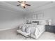 Bright main bedroom featuring tray ceiling, neutral decor, and plush carpeting at 288 Whispering Wind Dr, Chapel Hill, NC 27516