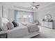 This main bedroom has a dresser, armchair, and large windows at 288 Whispering Wind Dr, Chapel Hill, NC 27516