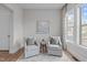 Cozy sitting room with natural light and comfortable seating at 288 Whispering Wind Dr, Chapel Hill, NC 27516
