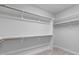 Spacious walk-in closet features ample shelving and clothing rods for optimal storage and organization at 288 Whispering Wind Dr, Chapel Hill, NC 27516