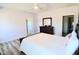 Well-lit bedroom features wood-look floors and a ceiling fan at 2915 Cox Mill Rd, Sanford, NC 27332