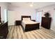 Spacious bedroom features wood-look floors and a ceiling fan at 2915 Cox Mill Rd, Sanford, NC 27332