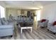 Open concept living space with modern furniture and bright natural light at 2915 Cox Mill Rd, Sanford, NC 27332
