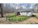 View of the back of the home featuring a screened porch, deck and fenced yard at 3014 Split Wood Ct, Oxford, NC 27565