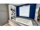 Bright bathroom featuring a soaking tub, built-in shelving, modern fixtures, and stylish tile work at 3014 Split Wood Ct, Oxford, NC 27565