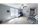 Bright bedroom featuring neutral walls, carpeted floor, windows, and a ceiling fan at 3014 Split Wood Ct, Oxford, NC 27565