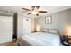 Neutral bedroom with a ceiling fan and closet offers calm retreat with space for relaxation and storage at 3014 Split Wood Ct, Oxford, NC 27565