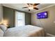 Relaxing bedroom with lots of light, a ceiling fan, and TV offering a comfortable and inviting space at 3014 Split Wood Ct, Oxford, NC 27565