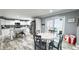 The eat-in kitchen features an island, stainless appliances, and access to the outdoor deck at 3014 Split Wood Ct, Oxford, NC 27565