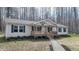 Charming single-story home with a welcoming front porch and fresh landscaping at 3014 Split Wood Ct, Oxford, NC 27565