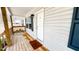 Charming front porch with wooden deck, overhead light, and siding of home at 3014 Split Wood Ct, Oxford, NC 27565