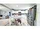 Spacious eat-in kitchen features an island, stainless steel appliances, and white cabinetry at 3014 Split Wood Ct, Oxford, NC 27565