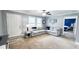 Bright living room with plush seating, a ceiling fan, and a view into the adjacent bedroom at 3014 Split Wood Ct, Oxford, NC 27565