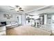 Open-concept living room and kitchen with stainless steel appliances and a cozy sectional sofa at 3014 Split Wood Ct, Oxford, NC 27565