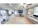 Open living space featuring a ceiling fan, a comfortable sofa, and natural light at 3014 Split Wood Ct, Oxford, NC 27565