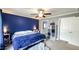 Main bedroom featuring a ceiling fan, neutral carpet, and a connecting bathroom at 3014 Split Wood Ct, Oxford, NC 27565