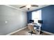This well-lit office features neutral tones, large windows, and space for dual monitors offering comfort and function at 3014 Split Wood Ct, Oxford, NC 27565