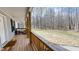 View from the spacious wooden porch of a large lot with mature trees at 3014 Split Wood Ct, Oxford, NC 27565