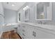 Bathroom with double sink vanity, soaking tub, and modern fixtures at 302 Rushingwater Dr, Cary, NC 27513