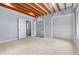 Bedroom with walk in closet, laundry, and exposed ceiling beams at 302 Rushingwater Dr, Cary, NC 27513