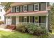 Charming two-story home with a welcoming porch and well-maintained landscaping at 302 Rushingwater Dr, Cary, NC 27513