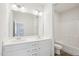 Bathroom with double vanity, a large mirror, toilet, and shower-tub combination at 3348 Table Mountain Pine Dr, Raleigh, NC 27616