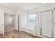 Bathroom features a soaking tub with tile surround, a glass-enclosed shower, and modern fixtures at 3348 Table Mountain Pine Dr, Raleigh, NC 27616
