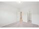 Bedroom with neutral carpeting, white walls and door that leads to a walk in closet at 3348 Table Mountain Pine Dr, Raleigh, NC 27616