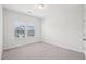 Bright bedroom featuring neutral carpeting and a window letting in natural light at 3348 Table Mountain Pine Dr, Raleigh, NC 27616