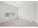 Bright bedroom featuring neutral carpet, double windows, and ample natural light at 3348 Table Mountain Pine Dr, Raleigh, NC 27616
