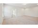 A spacious bedroom featuring neutral carpet and an adjacent bathroom, creating a convenient and private retreat at 3348 Table Mountain Pine Dr, Raleigh, NC 27616
