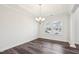 Elegant dining room with chandelier, hardwood floors and plenty of natural light at 3348 Table Mountain Pine Dr, Raleigh, NC 27616