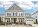 Charming two-story home with an attached garage, covered porch, and beautifully landscaped front yard at 3348 Table Mountain Pine Dr, Raleigh, NC 27616