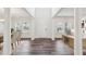Bright foyer with soaring ceilings, elegant columns, and wood-look flooring at 3348 Table Mountain Pine Dr, Raleigh, NC 27616