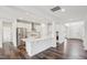 Open-concept kitchen with white cabinetry, stainless steel appliances, and quartz countertops at 3348 Table Mountain Pine Dr, Raleigh, NC 27616