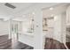 Kitchen with white cabinetry, stainless steel appliances, and hardwood floors at 3348 Table Mountain Pine Dr, Raleigh, NC 27616