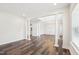 Bright, open-concept living room featuring elegant columns and hardwood floors at 3348 Table Mountain Pine Dr, Raleigh, NC 27616