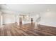Bright, open-concept living room and kitchen with hardwood floors and stainless steel appliances at 3348 Table Mountain Pine Dr, Raleigh, NC 27616