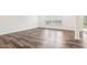 Large living room with beautiful hardwood floors and natural light, perfect for entertaining at 3348 Table Mountain Pine Dr, Raleigh, NC 27616