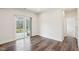 Cozy living area with sliding glass doors and hardwood floors, offering seamless indoor-outdoor living at 3348 Table Mountain Pine Dr, Raleigh, NC 27616