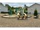 Community playground with green slide and bench seating offers residents a safe play area at 3348 Table Mountain Pine Dr, Raleigh, NC 27616