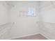 Walk-in closet with neutral carpet and wire shelving provides plenty of storage space at 3348 Table Mountain Pine Dr, Raleigh, NC 27616