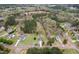 An aerial view displays the home's location within a wooded neighborhood at 3690 Mabel Ln, Stem, NC 27581