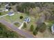 Aerial view shows the home's position on a corner lot, complete with a long driveway at 3690 Mabel Ln, Stem, NC 27581