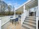 Spacious back deck with comfortable seating, perfect for outdoor dining and relaxation at 3690 Mabel Ln, Stem, NC 27581