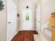 Inviting entryway featuring hardwood floors, a decorative light fixture, and ample natural light at 3690 Mabel Ln, Stem, NC 27581