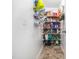 Walk in pantry with lots of shelves filled with food items and storage containers at 3690 Mabel Ln, Stem, NC 27581