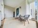 Inviting front porch with comfortable seating, perfect for enjoying the outdoors at 3690 Mabel Ln, Stem, NC 27581