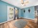 Bright sun room with French doors, a ceiling fan, and unique decor at 3690 Mabel Ln, Stem, NC 27581