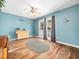 Charming sun room featuring French doors, a serving table, and appealing decorations at 3690 Mabel Ln, Stem, NC 27581